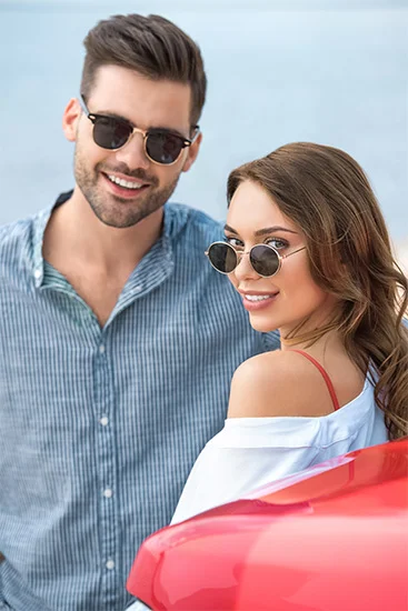 Couple wearing stylish sunglasses at Cooper & Lourie Optometrists Innaloo.