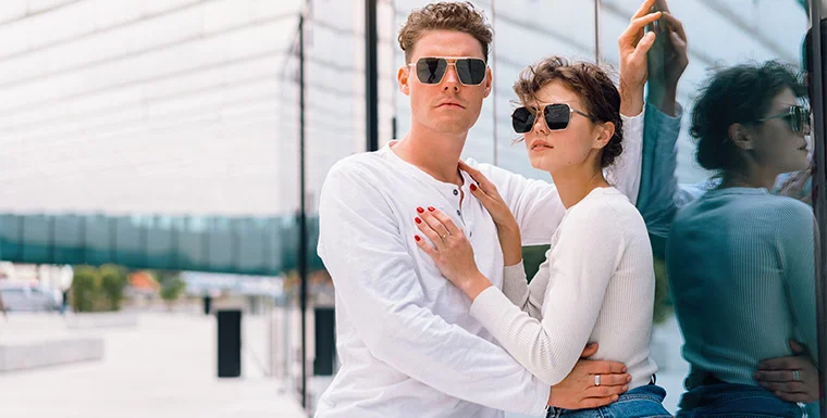 Man and woman wearing stylish designer sunglasses and lifestyle eyewear in an urban setting