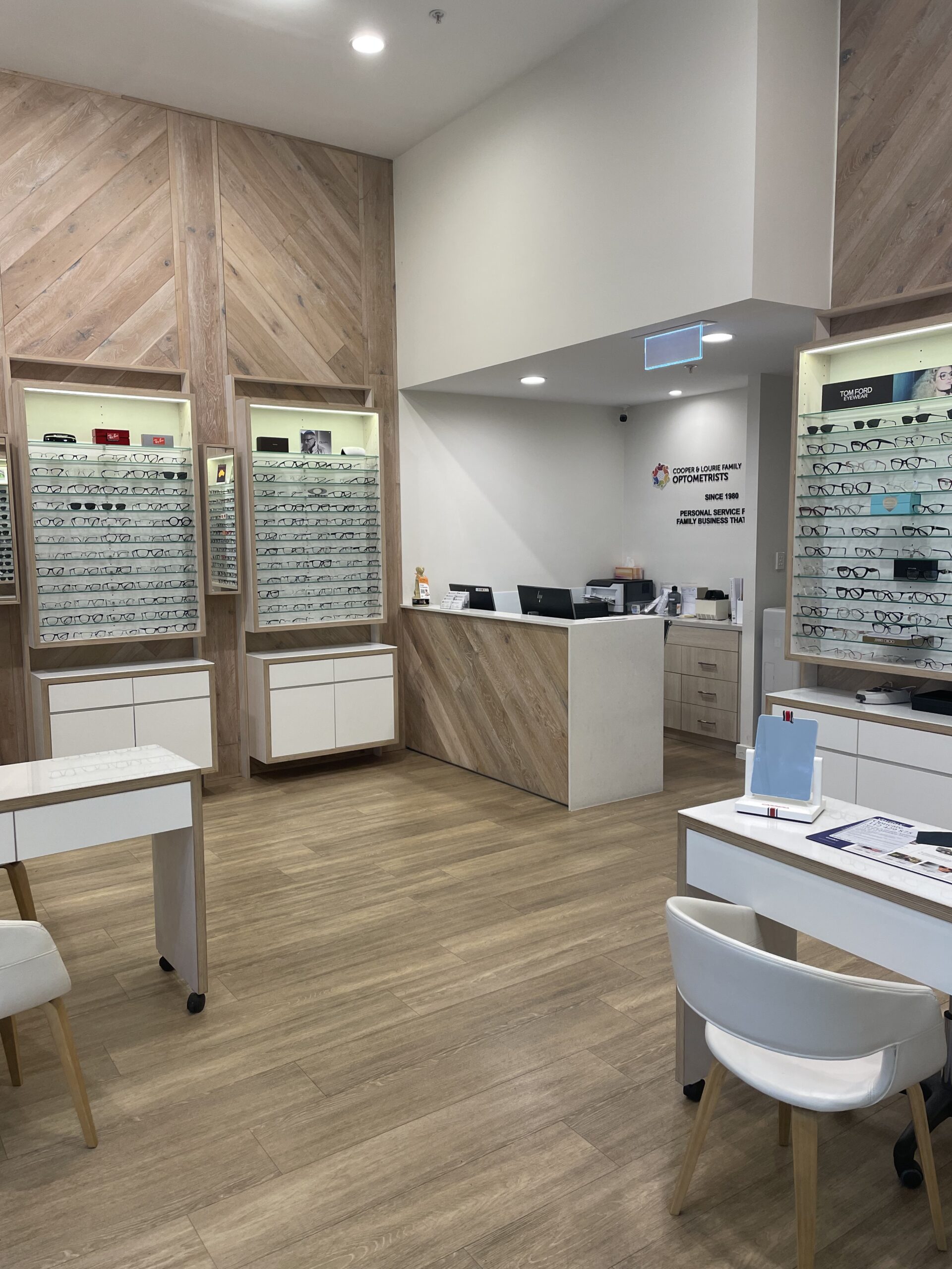 Couple wearing stylish sunglasses at Cooper & Lourie Optometrists Innaloo.