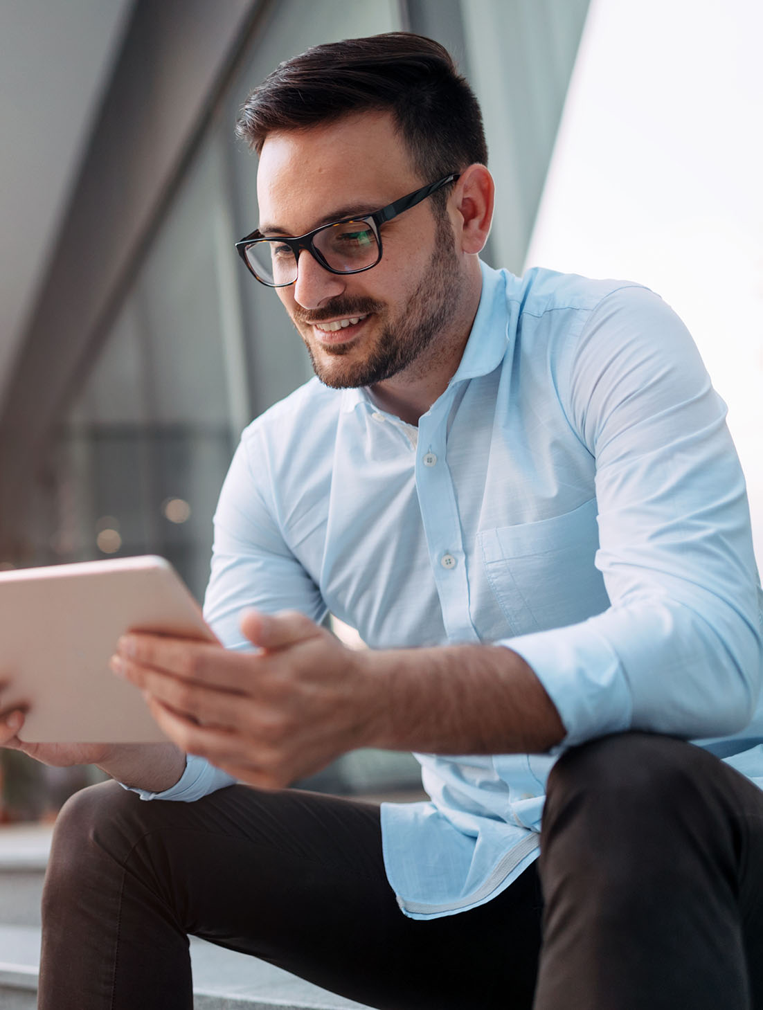 Portrait,Of,Businessman,In,Glasses,Holding,Tablet Couple wearing stylish sunglasses at Cooper & Lourie Optometrists Innaloo.